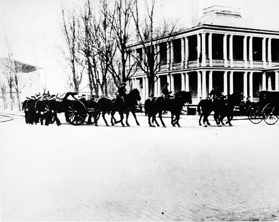 Military cortege accompanies James Smithson's remains from the Washington Navy Yard to the Smithsonian, on January 23, 1904. This image shows the Marine caisson as it makes its way with procession of individuals on foot, on horses, and horse and carriage. James Smithson (c.1765-1829) died in Genoa, Italy, and was buried there. However, after the turn of the century, the Smithsonian was notified that the graves were to be moved to allow quarrying on the cemetery site. Smithsonian Regent Alexander Graham Bell and his wife Mabel traveled to Italy to oversee the disinterrment of Smithson's remains and their transportation to the Institution in Washington, D.C., that his bequest created. (Photographer unknown, 1904)