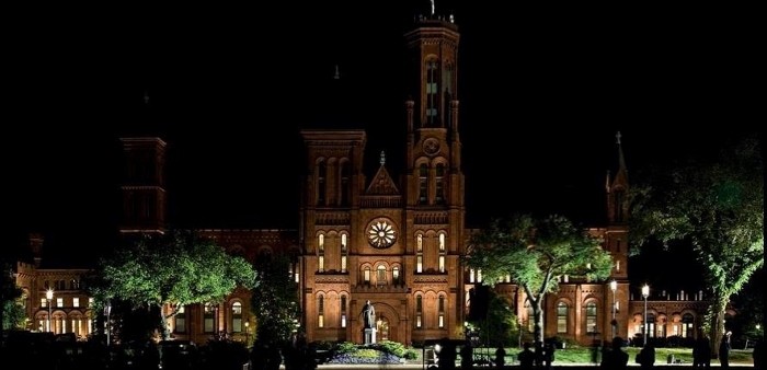 Dramatically lit Smithsonian Castle at night