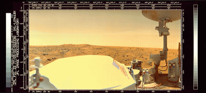 Viking lander in foreground; Martian horizon in the distance. 