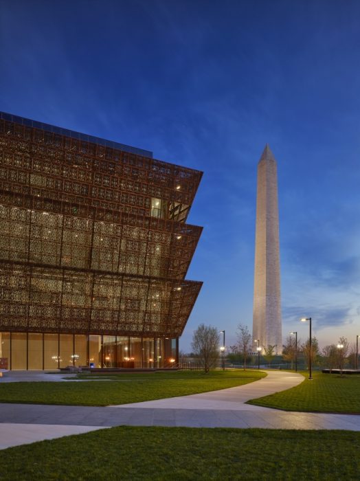 Museum at twilight with Washington Monument behind it