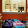 Sleeping bags in front of exhibit case