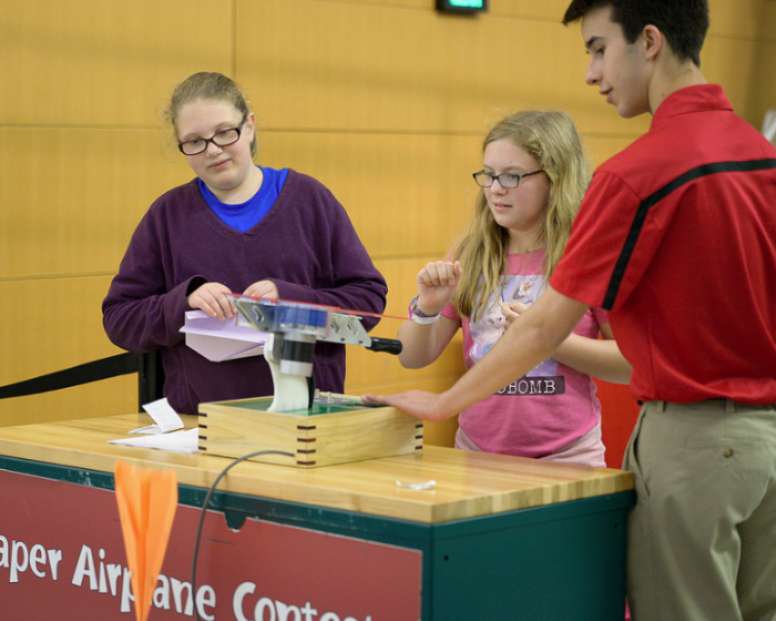 Girl and adult at activity table