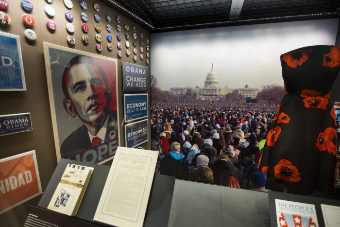 Exhibition artifacts on display, including Hope poster