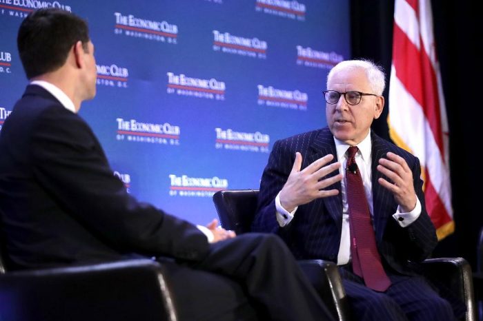 Rubenstein on stage at the Economics Club