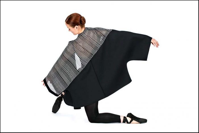 Model wearing black and gray kimono wrap
