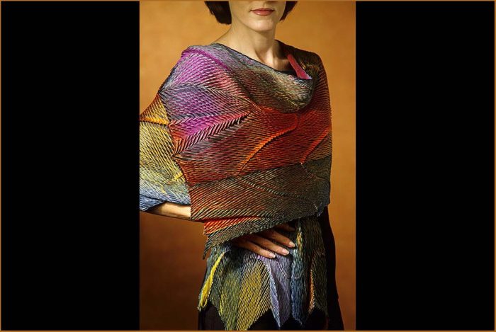 Model wearing colorfully dyed wrap