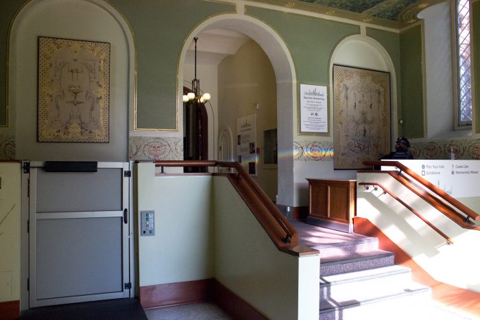 Wheelchair lift next to stairs in the Children's Room of the castle