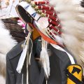 cropped banner featuring military uniforms draped with eagle feather bonnets