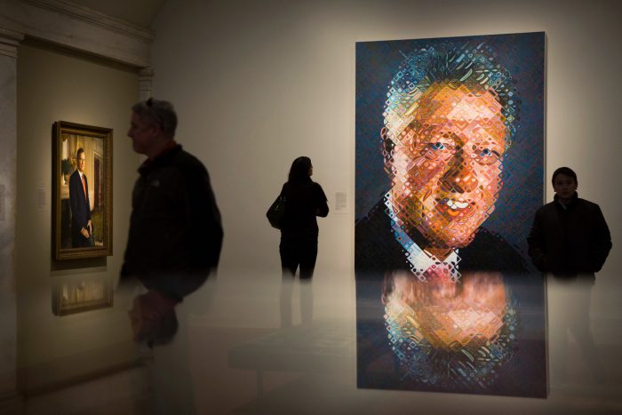 Visitors to Portrait Gallery, Clinton portrait prominent in foreground