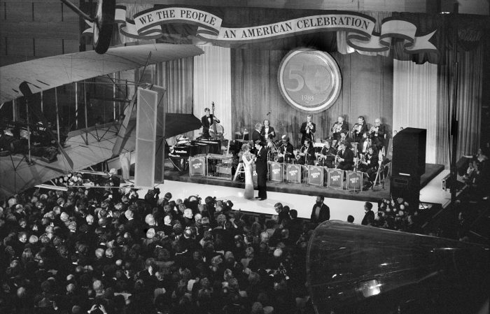 Reagans dancing on stage in front of orchestra