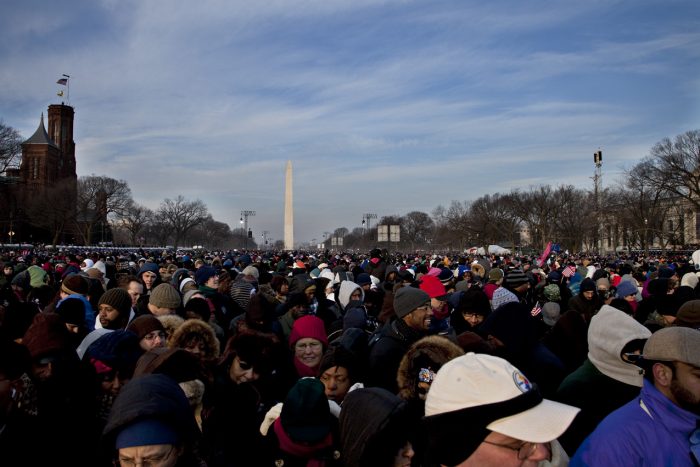 Crowds on the mall with Washington monument and SI castle in background and