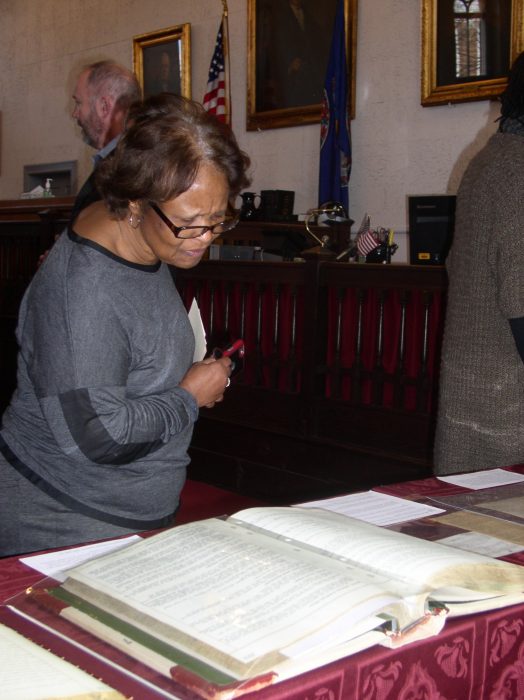 Woman looking at ledger books