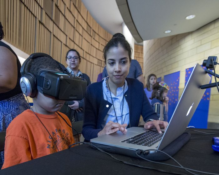 Child wearing virtual reality headgear