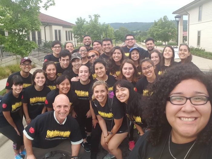 group in matching tshirts poses for a selfie