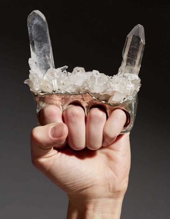 Crystal "horns" on brass knuckles