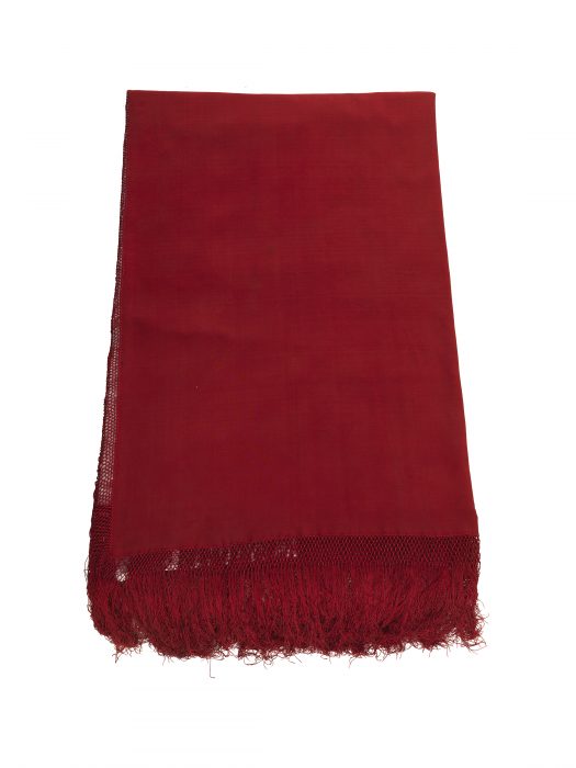 folded red shawl with fringe