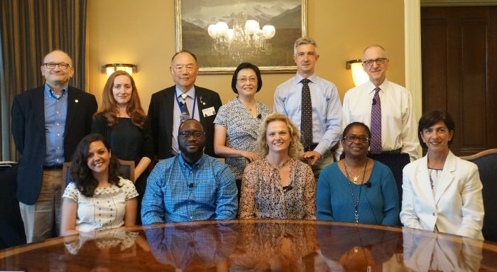 Group shot of participants seated around table in Secretary's parlor