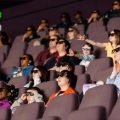 Audience wearing 3D glasses