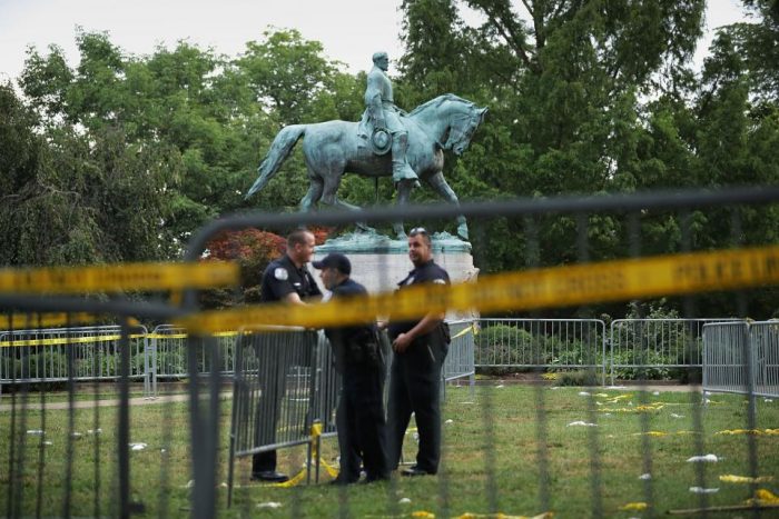 Confederate monument surroounded by barricades