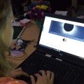 Girl using laptop with eclipse app