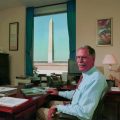 Withuhn at his desk with Washington Monument in background