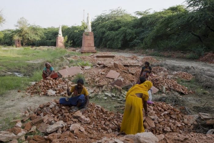 Women working among rubble