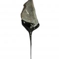 Stone ax dripping tar