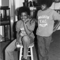 Two young people with Afros wearing YAC tshirts