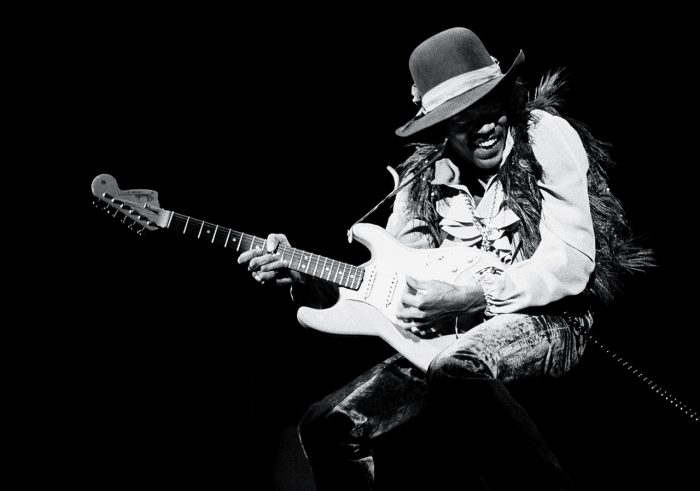 Black and white photo of Jimi Hendrix performing
