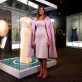 Melania Trump stands next to case with inaugural gown