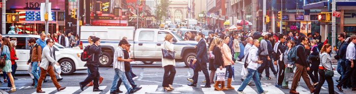 people crossing busy city street