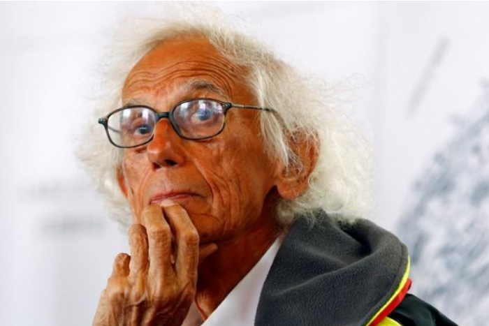 Close-up photo of artist Christo with hand on chin