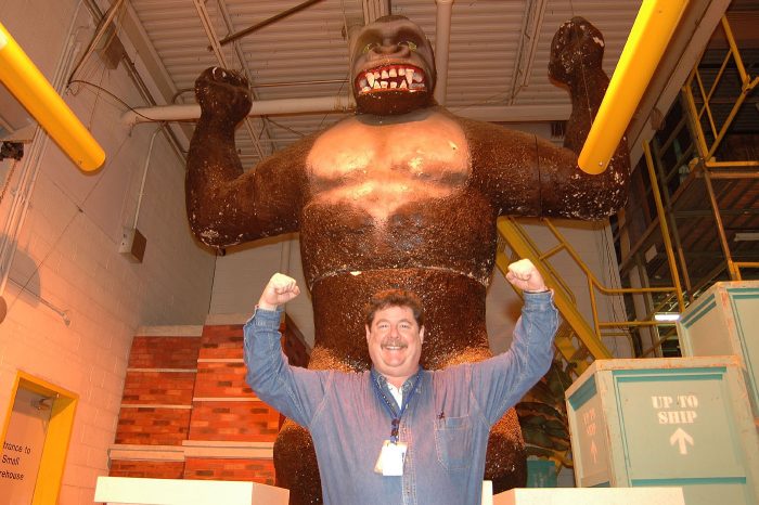 Jeff Tinsley poses in front of gorilla