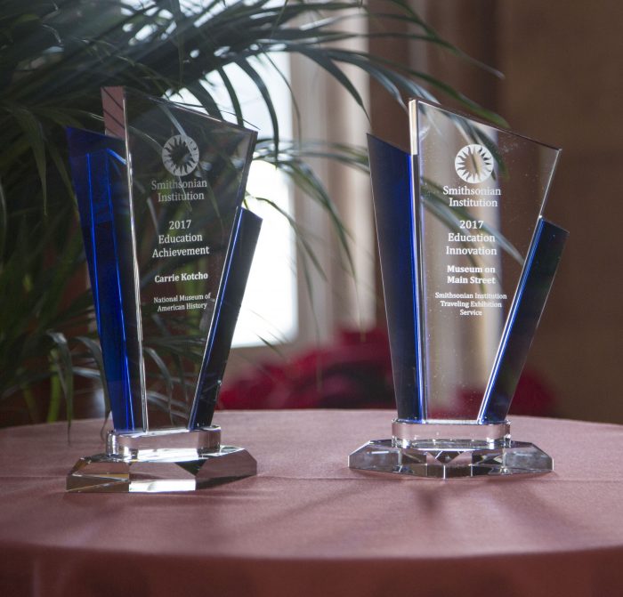 Two glass awards on table