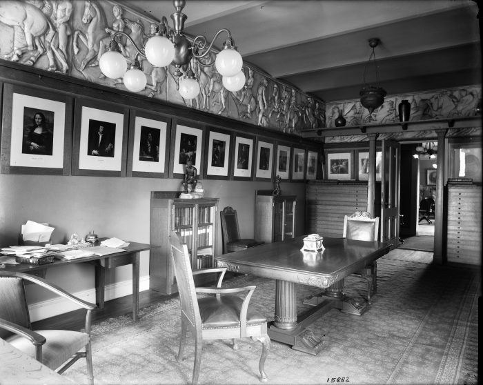 View of Art Room looking toward hallway with portraits on wall