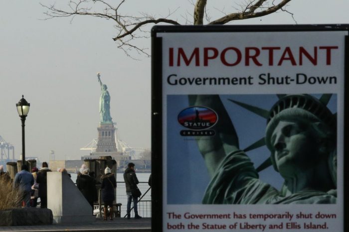 Statue of Liberty with closed sign in foreground