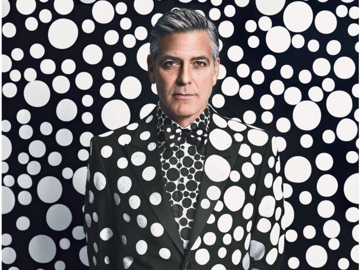 George Clooney in polk-dot suit against polka-dot background