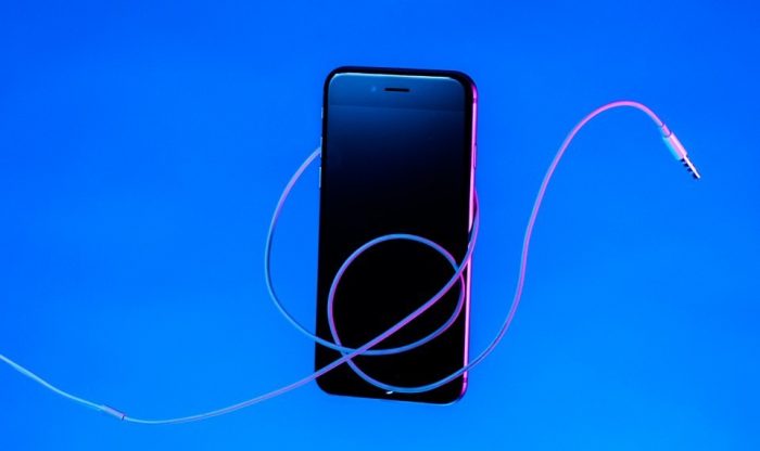 Stylized cell phone with earphone