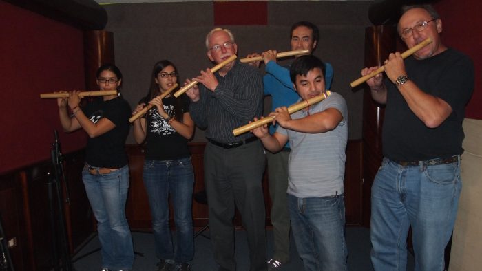 Group including Dan Sheehy playing flute