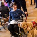 Woman in wheelchair with service dog