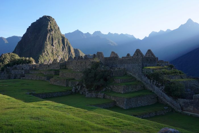 The sun rises over Machu Picchu.