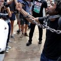 Two protesters confront each other