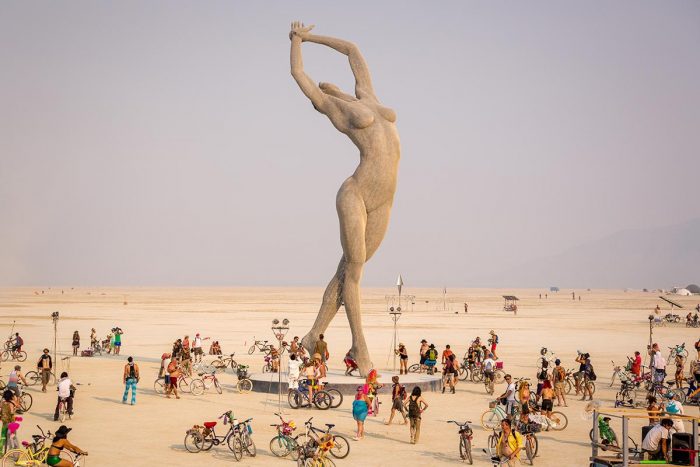 Large sculpture of naked woman, dwarfing onlookers
