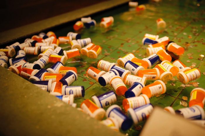 Pill bottles floating in fountain pool