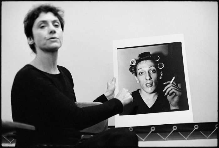 Diane Arbus holds large photo