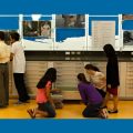 cropped photo of teens and interactive map