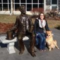 Hayes on bench with dog and Abraham Lincoln statue