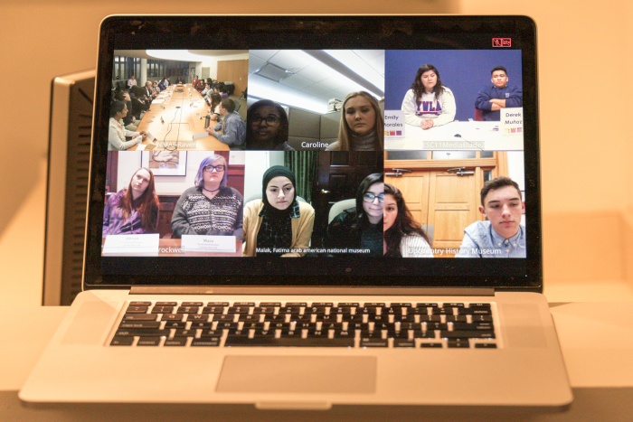 Photo of laptop screen showing videoconference participants.