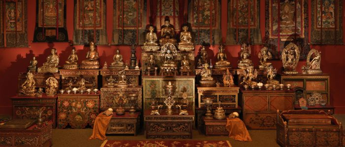 Shrine with several Buddhas on display