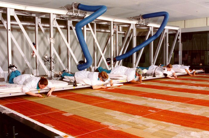 Conservators working on flag